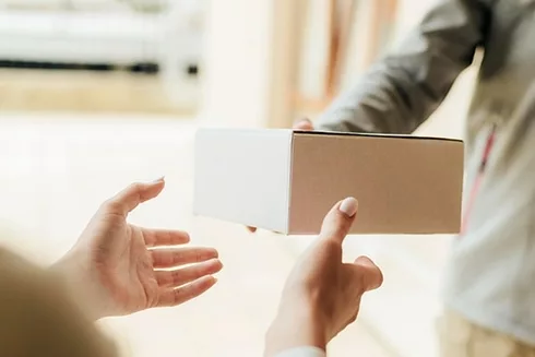 close-up-hands-getting-box-min